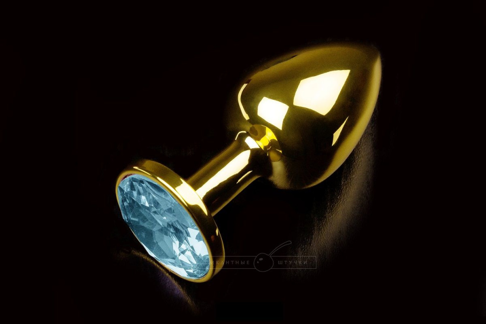 Маленькая золотистая анальная пробка с круглым кончиком и голубым кристаллом - 7 см. купить в секс шопе
