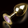 Большая золотая анальная пробка с закругленным кончиком и розовым кристаллом - 9 см. купить в секс шопе