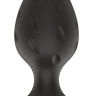 Черная средняя силиконовая анальная пробка с рельефом в виде углублений купить в секс шопе