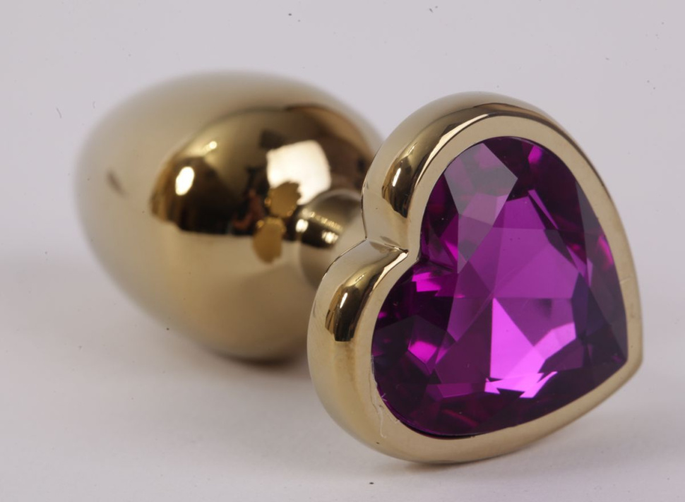 Золотистая анальная пробка с фиолетовым стразиком-сердечком - 8 см. купить в секс шопе