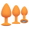 Набор из трёх оранжевых анальных пробок с кристаллом Cheeky Gems купить в секс шопе