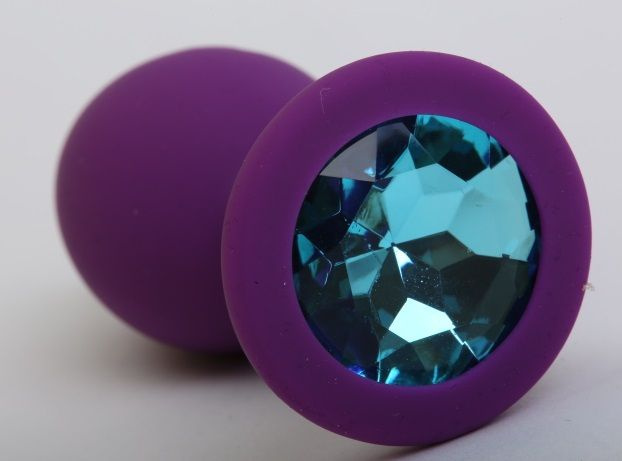 Фиолетовая силиконовая пробка с голубым стразом - 9,5 см. купить в секс шопе