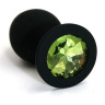 Чёрная силиконовая анальная пробка с светло-зеленым кристаллом - 7 см. купить в секс шопе