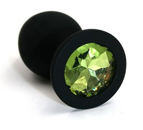 Чёрная силиконовая анальная пробка с светло-зеленым кристаллом - 7 см. купить в секс шопе