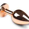 Золотистая анальная пробка с розовым кристаллом - 7 см. купить в секс шопе