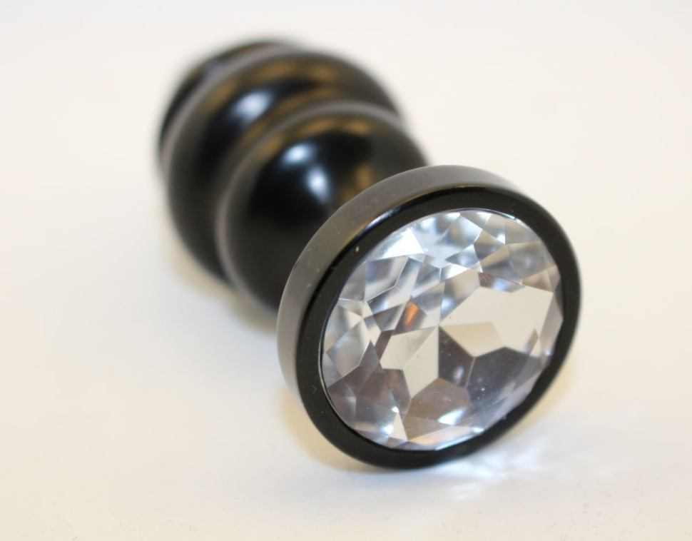 Черная фигурная анальная пробка с прозрачным кристаллом - 8,2 см. купить в секс шопе