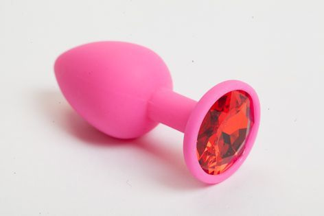 Розовая силиконовая пробка с красным стразом - 7 см. купить в секс шопе