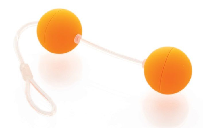 Оранжевые вагинальные шарики на прозрачной сцепке купить в секс шопе