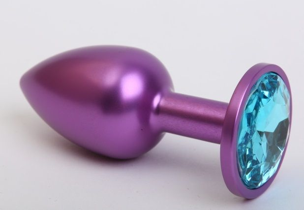 Фиолетовая анальная пробка с голубым стразом - 7,6 см. купить в секс шопе