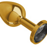 Золотистая анальная втулка с чёрным кристаллом - 7 см. купить в секс шопе