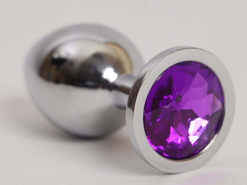 Серебристая анальная пробка с фиолетовым стразом - 9,5 см. купить в секс шопе