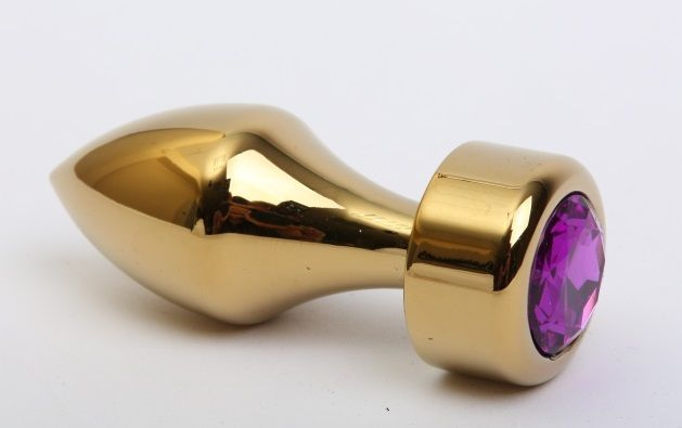 Золотистая анальная пробка с широким основанием и фиолетовым кристаллом - 7,8 см. купить в секс шопе