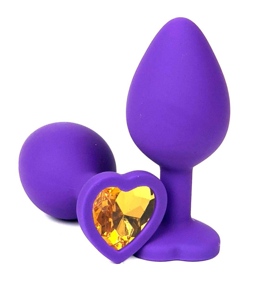 Фиолетовая силиконовая анальная пробка с оранжевым стразом-сердцем - 8,5 см. купить в секс шопе