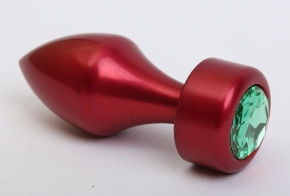 Красная анальная пробка с широким основанием и зелёным кристаллом - 7,8 см. купить в секс шопе