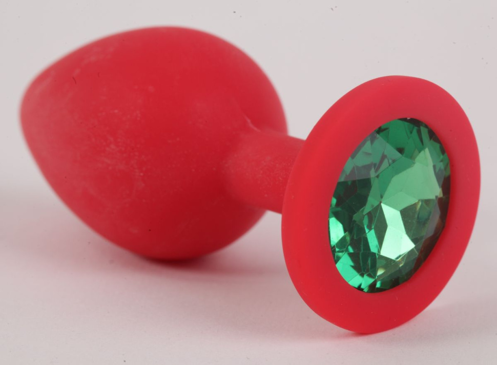 Красная силиконовая пробка с зеленым кристаллом - 9,5 см. купить в секс шопе