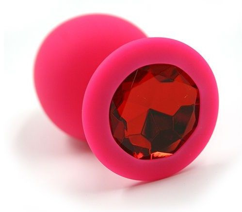 Розовая силиконовая анальная пробка с красным кристаллом - 8,3 см. купить в секс шопе
