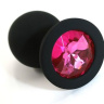 Чёрная силиконовая анальная пробка с ярко-розовым кристаллом - 7 см. купить в секс шопе
