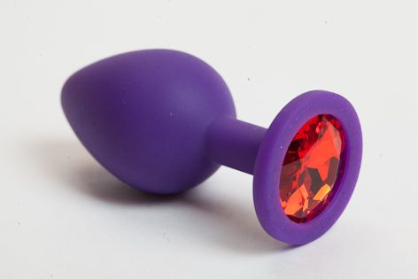 Фиолетовая силиконовая пробка с красным кристаллом - 9,5 см. купить в секс шопе