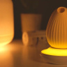 Желтый вакуум-волновой стимулятор с вибрацией и базой-ночником Cuddly Bird купить в секс шопе