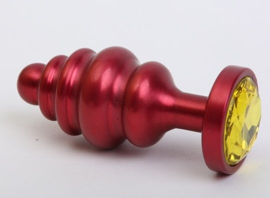 Красная ребристая анальная пробка с жёлтым стразом - 7,3 см. купить в секс шопе