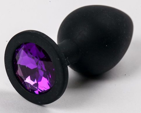 Черная силиконовая анальная пробка с фиолетовым кристаллом - 9,5 см. купить в секс шопе