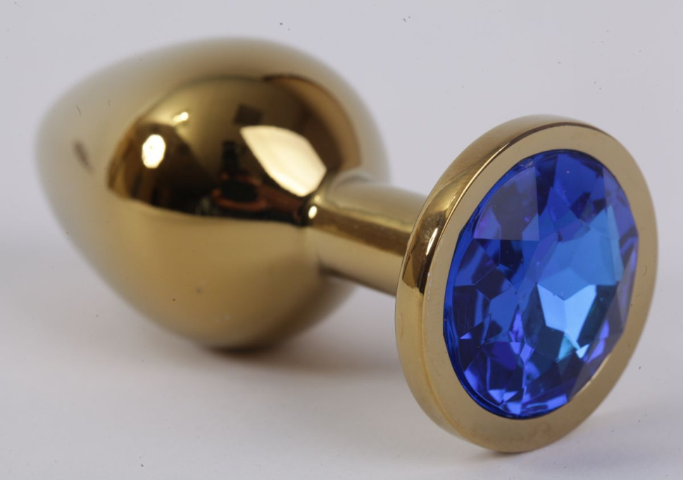 Золотистая анальная пробка с синим кристаллом - 8,2 см. купить в секс шопе