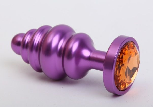 Фиолетовая ребристая анальная пробка с жёлтым кристаллом - 7,3 см. купить в секс шопе