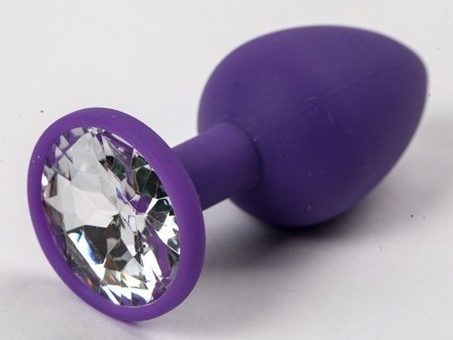 Фиолетовая силиконовая анальная пробка с прозрачным стразом - 7,1 см. купить в секс шопе