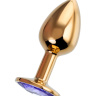 Золотистая анальная втулка с фиолетовым стразом - 7 см. купить в секс шопе
