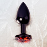 Черный анальный плаг с кристаллом красного цвета - 7,2 см. купить в секс шопе