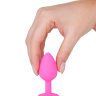 Розовая силиконовая анальная втулка с красным кристаллом - 7,3 см. купить в секс шопе