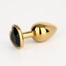 Золотистая анальная пробка с черным кристаллом в форме сердца - 7 см. купить в секс шопе