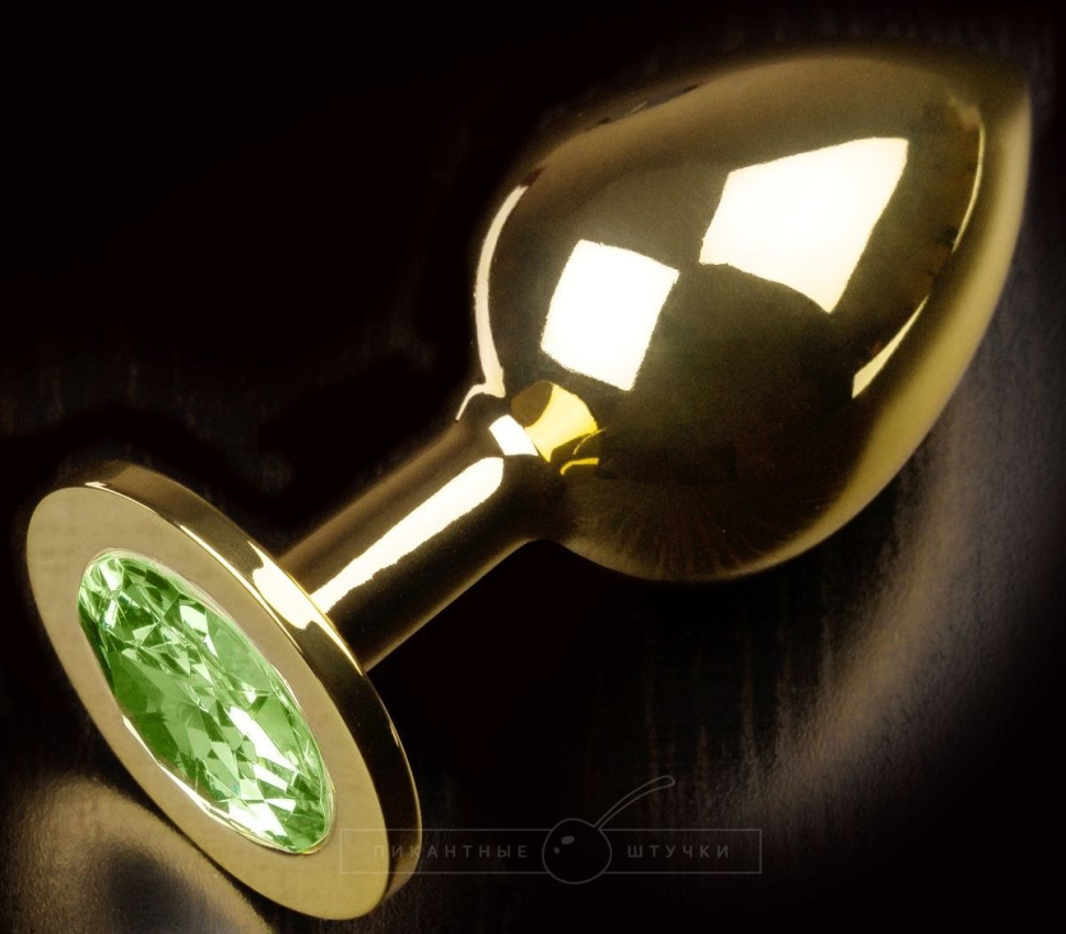 Золотистая анальная пробка с салатовым кристаллом - 9 см. купить в секс шопе