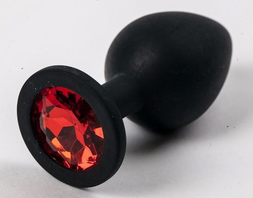 Черная силиконовая анальная пробка с красным стразом - 8,2 см. купить в секс шопе