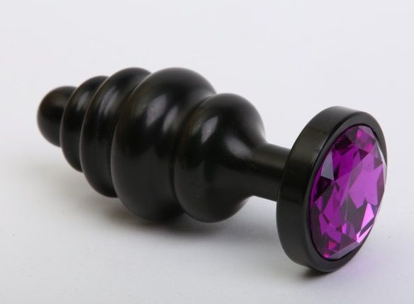 Чёрная ребристая анальная пробка с фиолетовым кристаллом - 7,3 см. купить в секс шопе