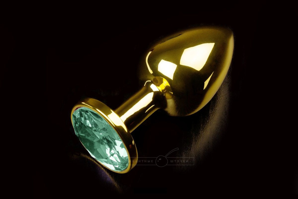 Маленькая золотистая анальная пробка с круглым кончиком и изумрудным кристаллом - 7 см. купить в секс шопе
